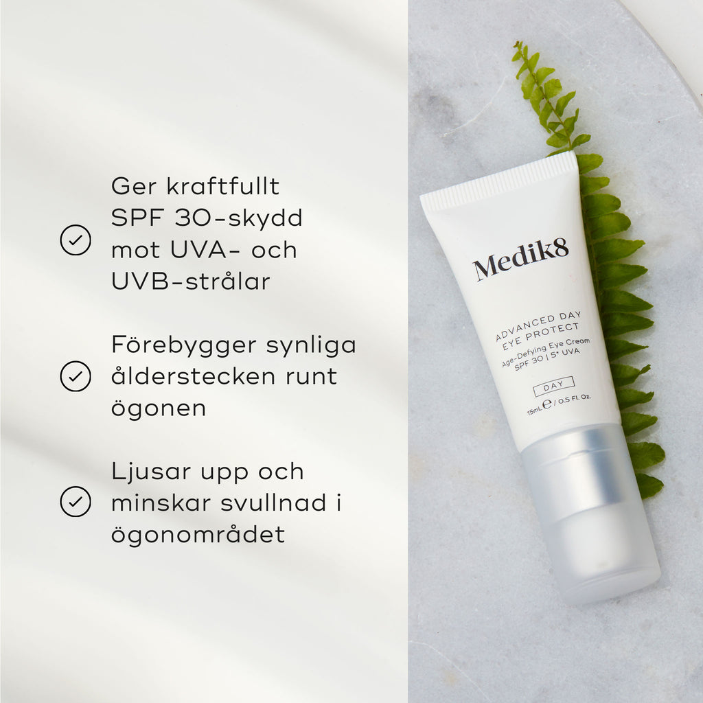Advanced Day Eye Protect ögonkräm från Medik8 liggande på en ljus yta bredvid ett ormbunksblad, med text om produktens fördelar som solskydd och anti-aging.